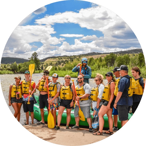 group beside river after colorado whitewater rafting