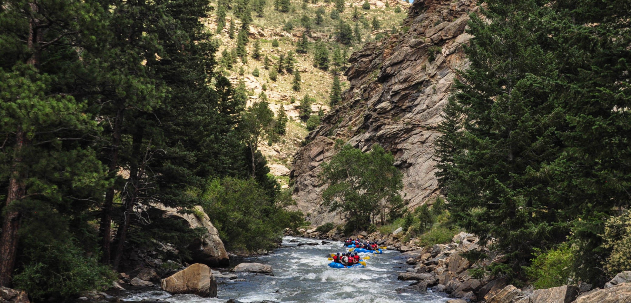multiple rafts float down lower clear creek canyon