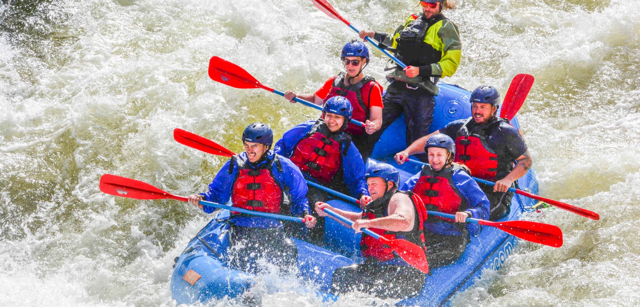 people navigating the rapids on an upper clear creek rafting trip