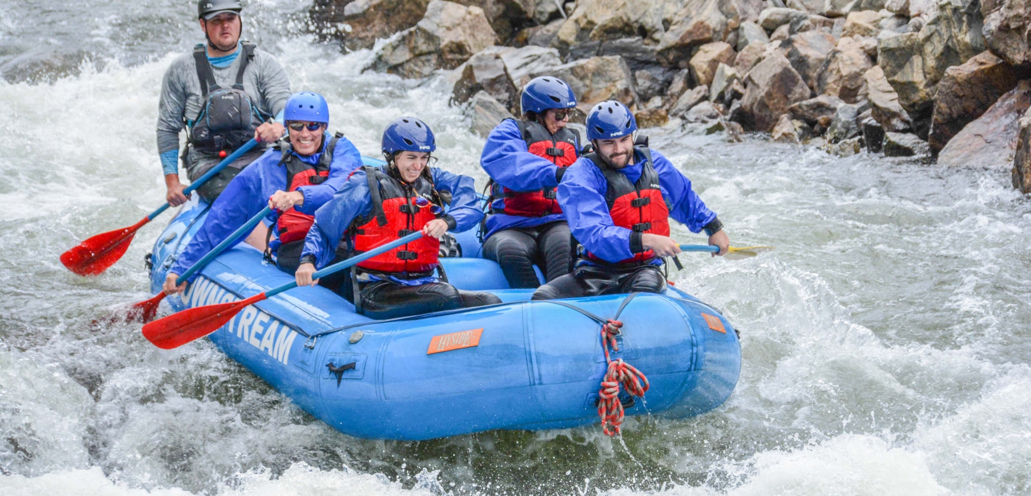 exciting rapids being navigated on a clear creek river rafting tour