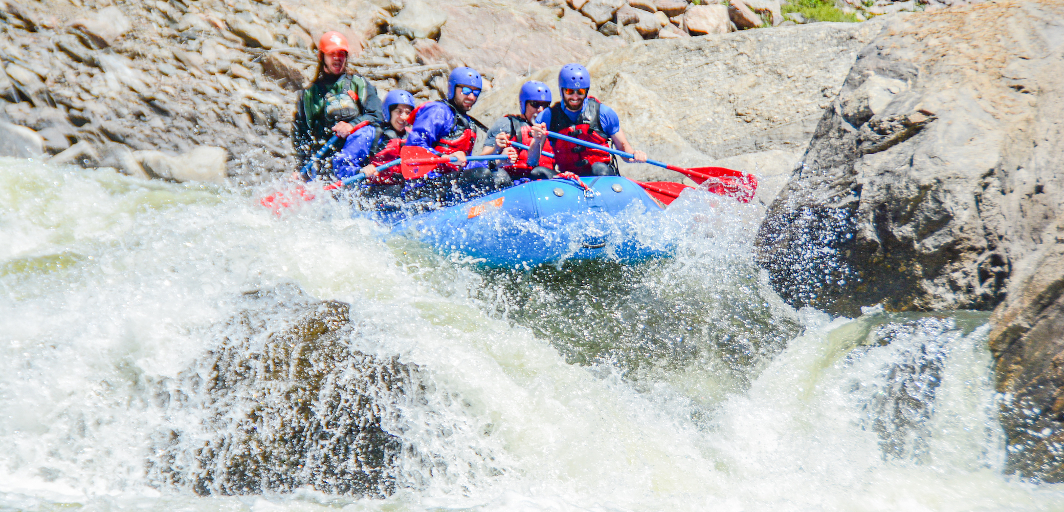 People navigating huge rapids on a Gore Canyon whitewater rafting trip in Colorado