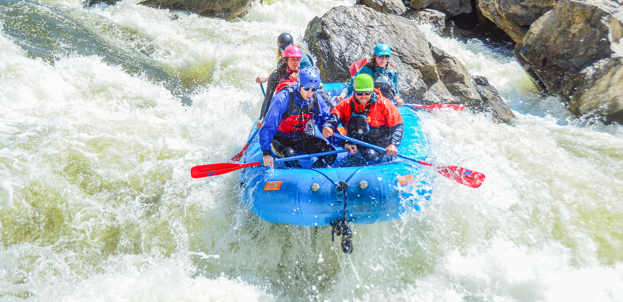 People navigating huge rapids on a Gore Canyon whitewater rafting trip in Colorado