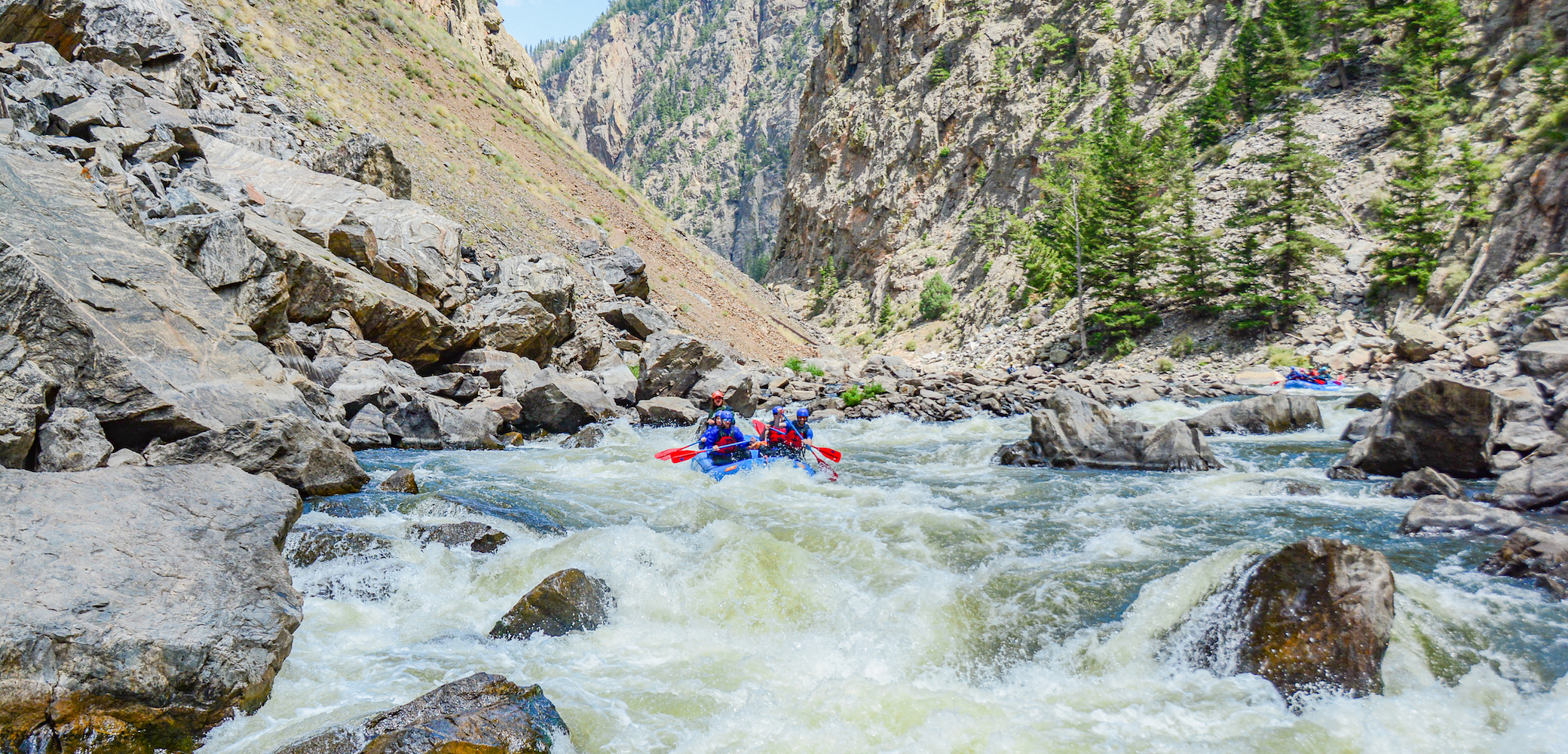 people hitting the rapids on a Gore Canyon rafting trip in Colorado