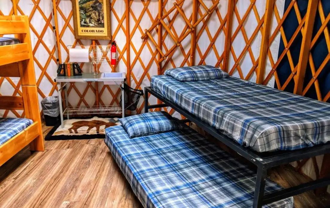 Glamping near denver with two bunk beds in a yurt