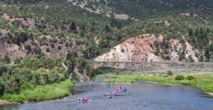 scenic image of the Upper Colorado River and people rafting with Downstream Adventures