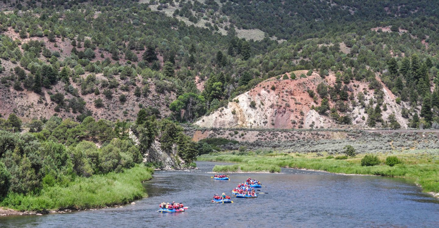 scenic image of the Upper Colorado River and people rafting with Downstream Adventures